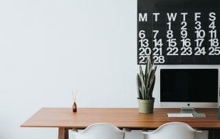 Minimalist lifestyle - desk with computer and calender
