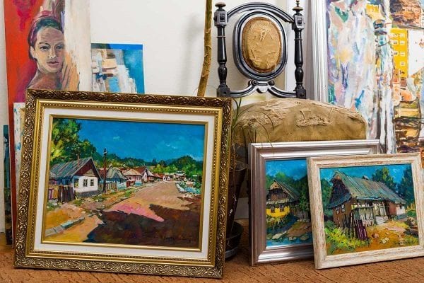 a collection of paintings on a table
