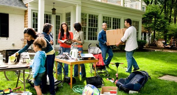 People buying items in a garage sale