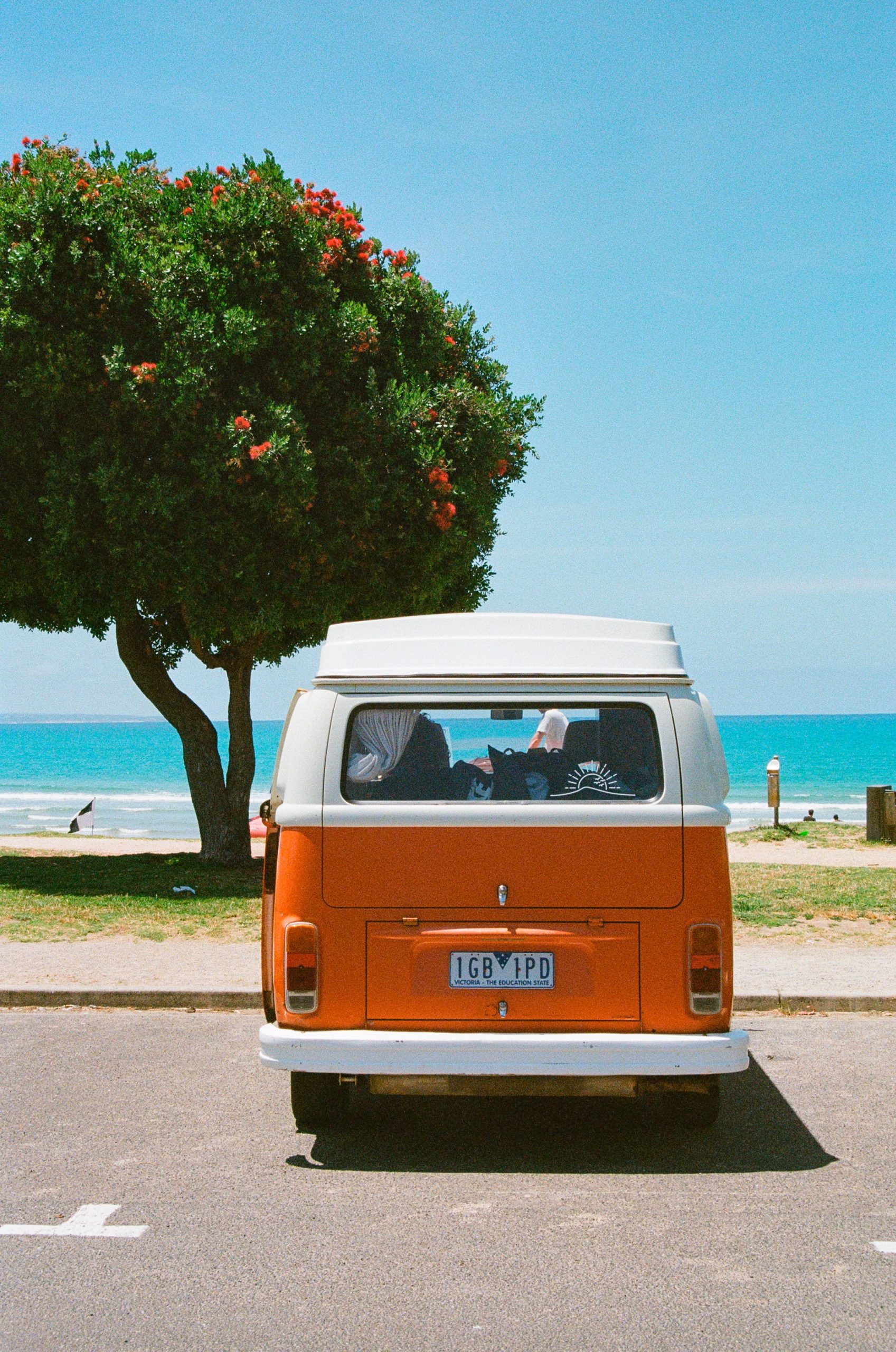 Image of van in front of a beach