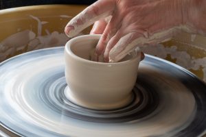 Person doing pottery
